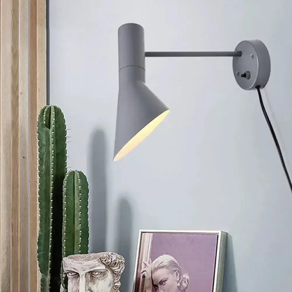 Modern white grey rotating node wall sconce with a sleek gray conical shade for bedroom lighting