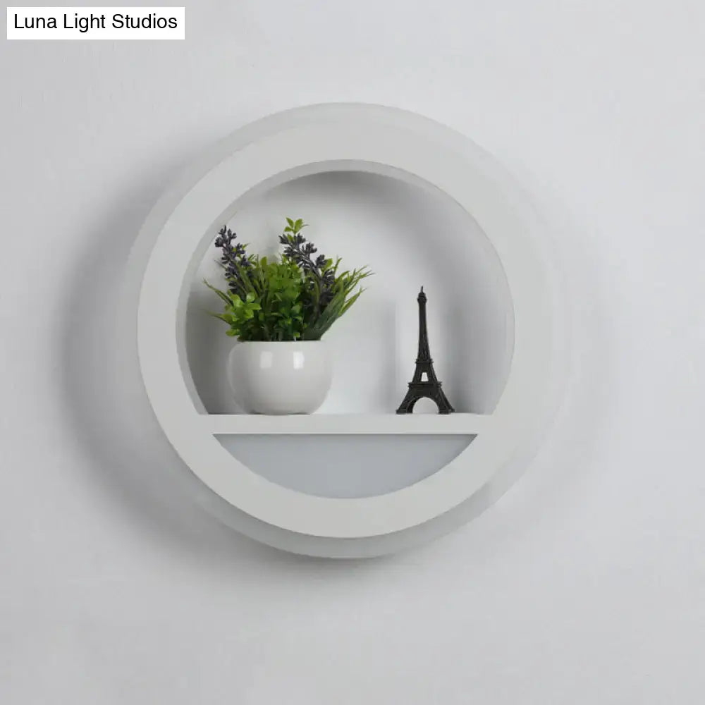 Modern white halo ring wall light fixture with recessed center and lower shelf for minimalist bedroom wall light design