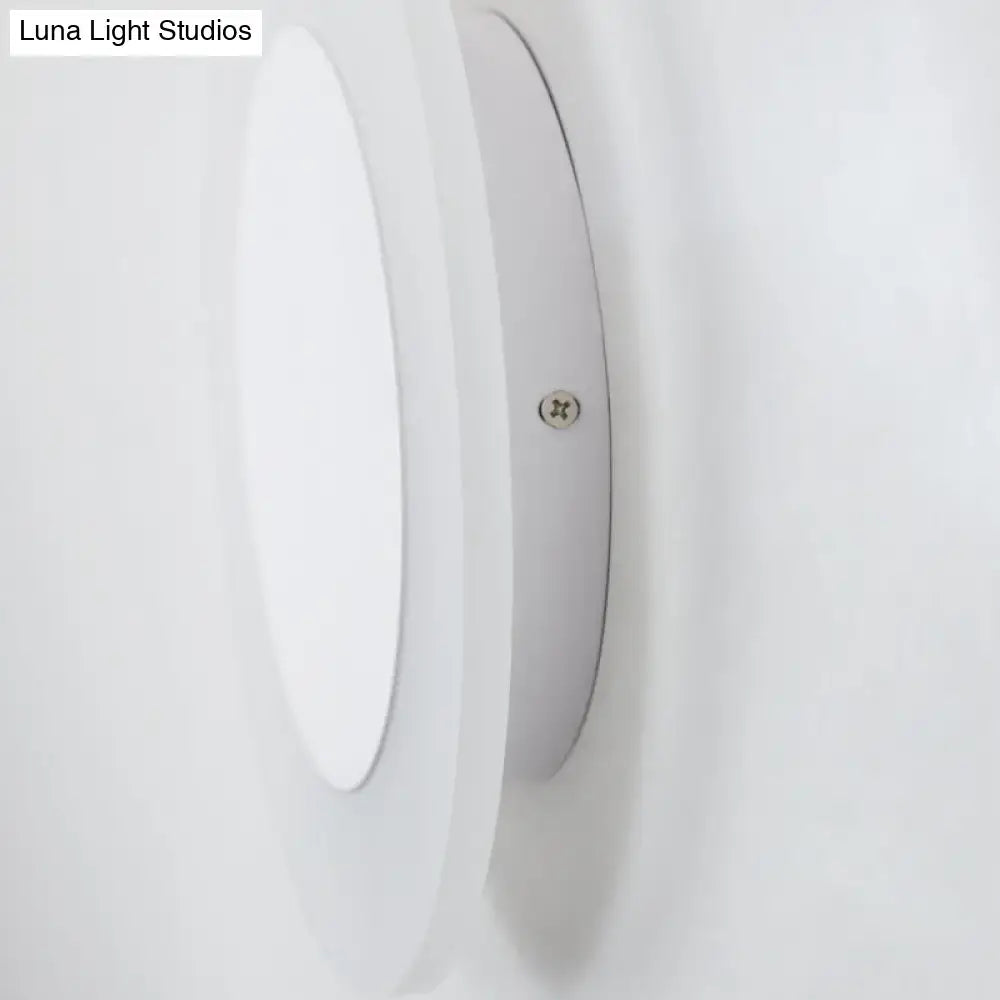 Modern white halo ring wall lighting fixture featuring a sleek circular recessed ceiling light for bedroom wall lighting