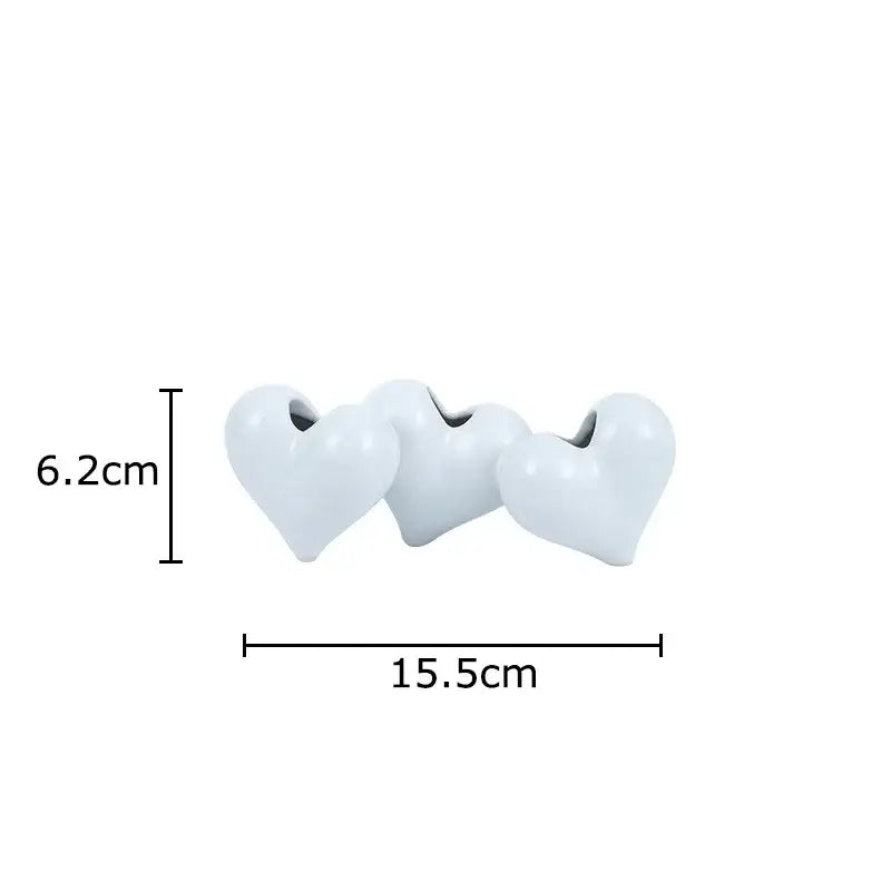 Three white ceramic heart beads with smooth glossy finish and central hole for stringing from decorbites heart ceramic vase decorbites heart