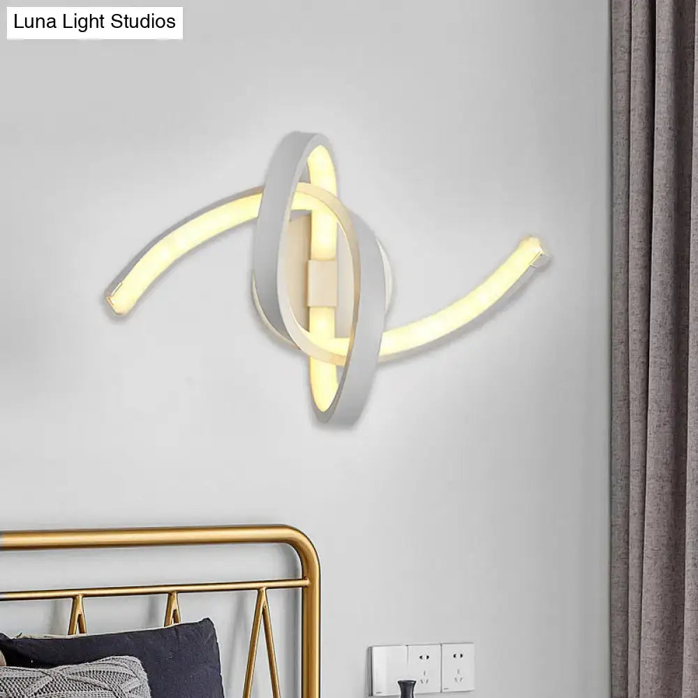 Modern white knotted linear wall sconce featuring intertwined gold led light strips in a minimalist abstract knot design