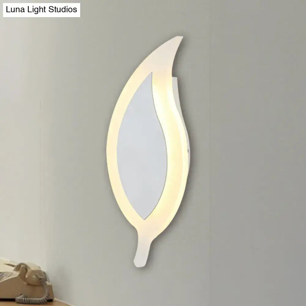 Modern white leaf wall lamp with glowing LED light frame and mirrored center for warm and white bedroom lighting