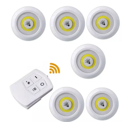 Set of six white led cabinet lights with yellow illumination and remote control dimming for kitchen use