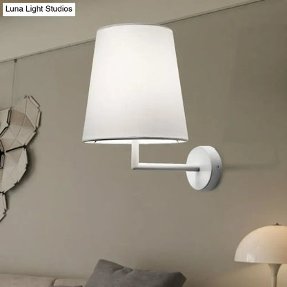 Modern white led cone wall mounted fabric sconce featuring a white cylindrical lampshade and minimalist design for living room lighting