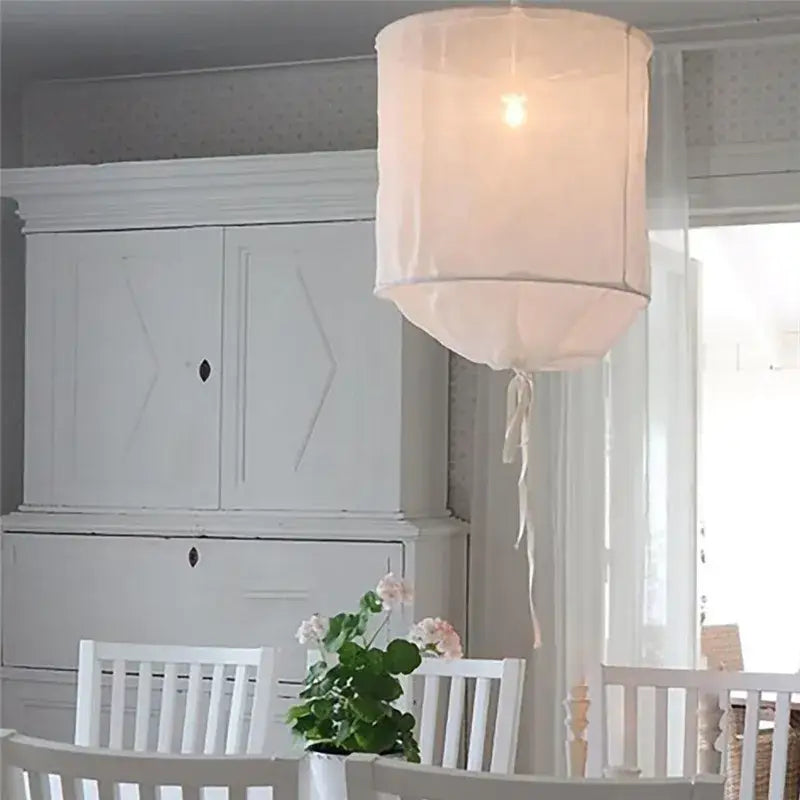 Modern white linen cotton pendant lamp with soft off-white sheer fabric and tied ribbon for kitchen island lighting