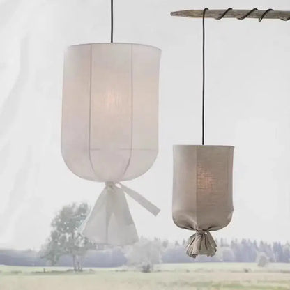 Two cylindrical pendant lamps in soft off-white and muted beige decorbites linen cotton pendant for kitchen island lighting