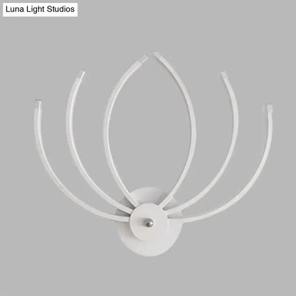 Modern white lotus wall sconce with five curved slender arms radiating from a circular base for bedroom lighting