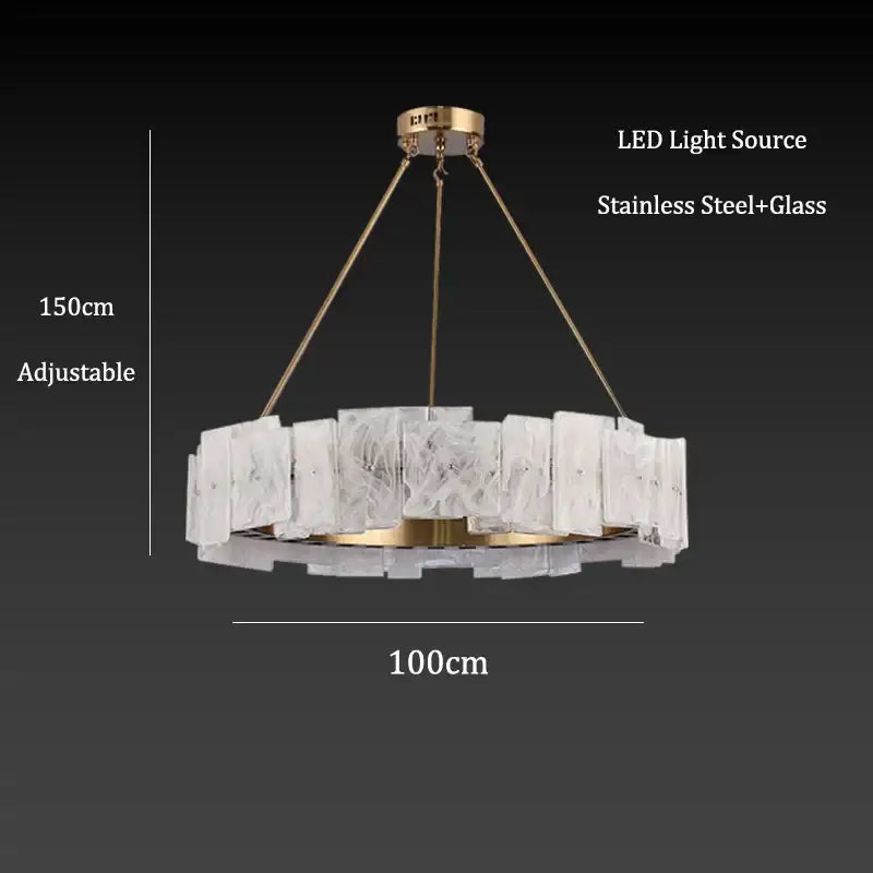 A modern circular pendant light with cloud mist glass and gold-toned stainless steel frame for dining room decorbites