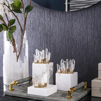 Set of three modern white marble crystal stone sculptures with clear quartz and golden accents for living room decor