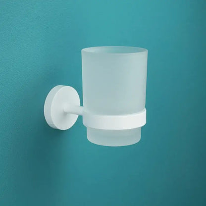 Modern white matte metal bathroom accessory set featuring a white frosted glass toothbrush holder with wall-mounted base decorbites bathroom accessory