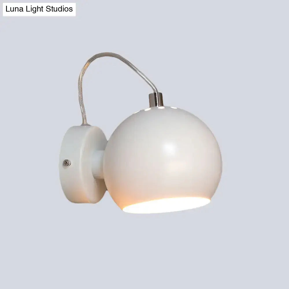 Modern white wall light with curved metal shade and frosted glass designed for 110v-120v bedroom use