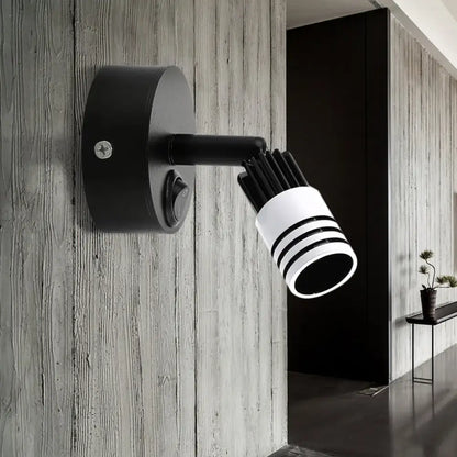 Modern white metal wall mounted led spotlight with cylindrical head and three horizontal stripes for bedroom reading