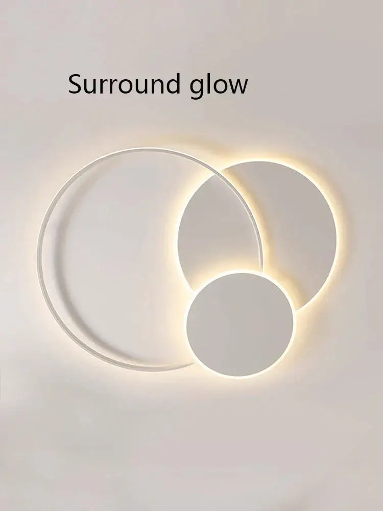 Modern white minimalist circles led ceiling light with three overlapping rings emitting warm ambient glow for bedroom decorbites circles led ceiling