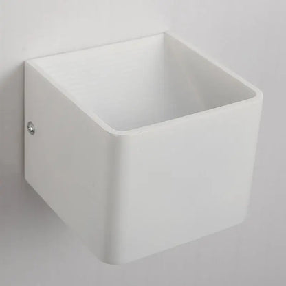 Modern white minimalist led wall lamp with a smooth matte finish designed as a bedroom sconce wall lamp
