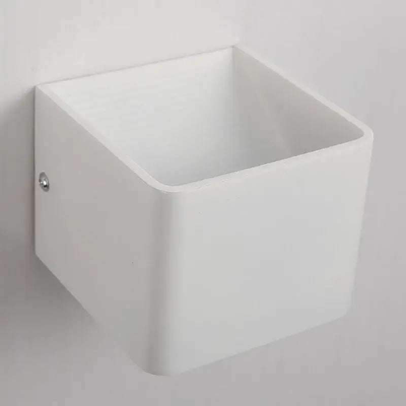 Modern white minimalist led wall lamp with a smooth matte finish designed as a bedroom sconce wall lamp