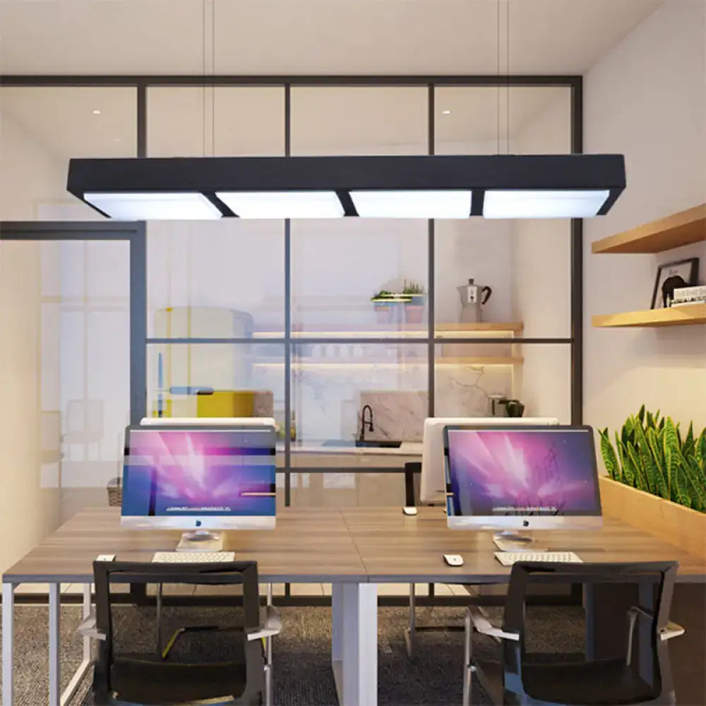 Decorbites modern metal rectangular island lamp in black with four illuminated panels above wooden desk