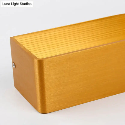 Modern white rectangular wall lamp with gold brushed metal finish and warm white light for bedroom sconce use