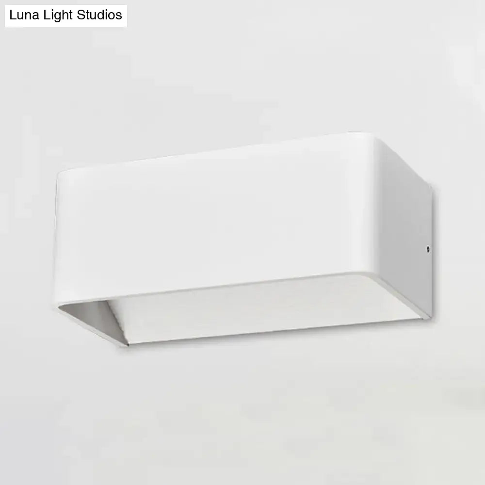 Modern white rectangular wall lamp with warm white light and sleek matte finish for bedroom use