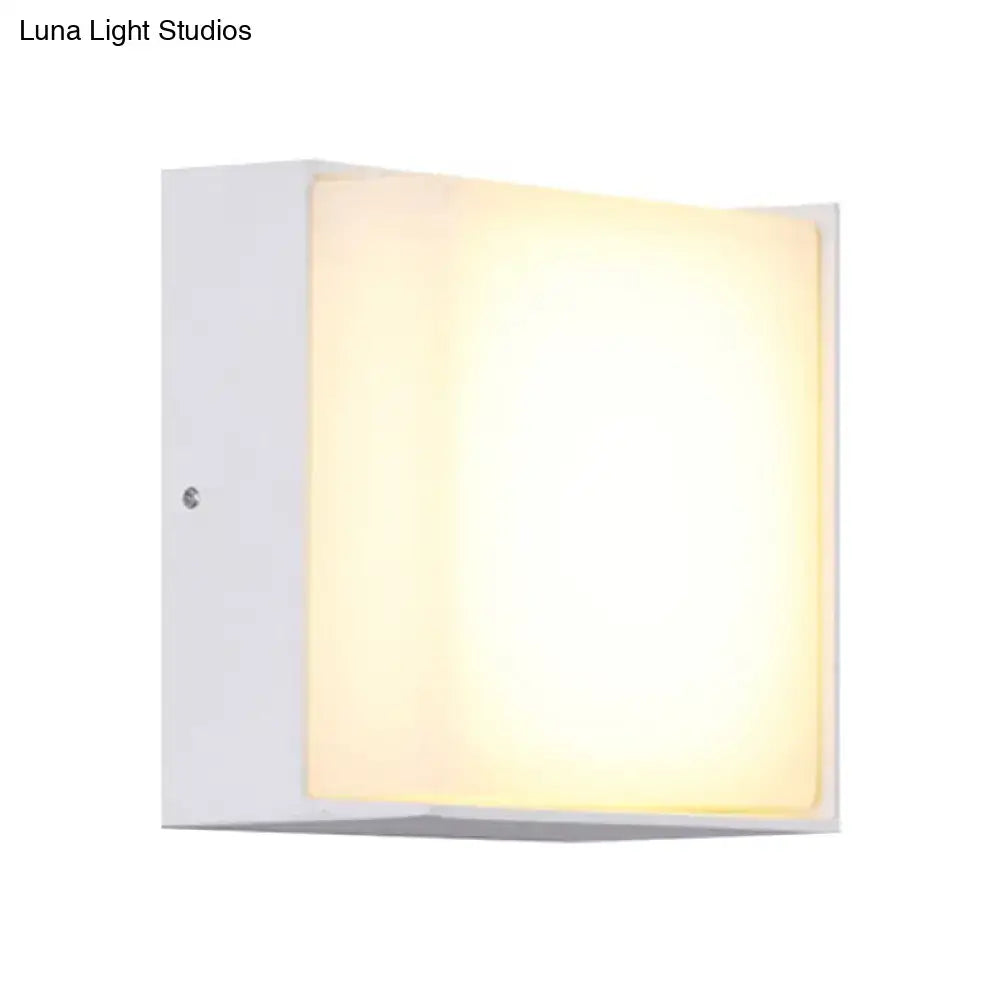 Modern white rectangular wall light with warm white diffused glow direct wired for hallway lighting