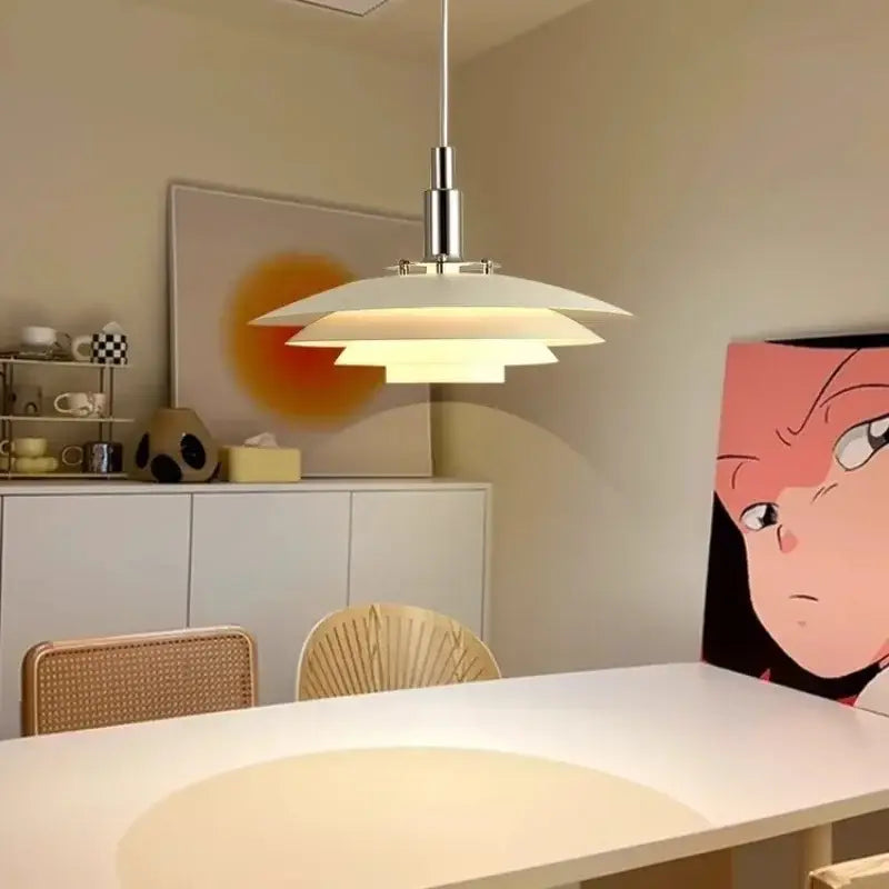 Modern white layered pendant light with sleek chrome finish and adjustable cord for modern interiors and kitchen use