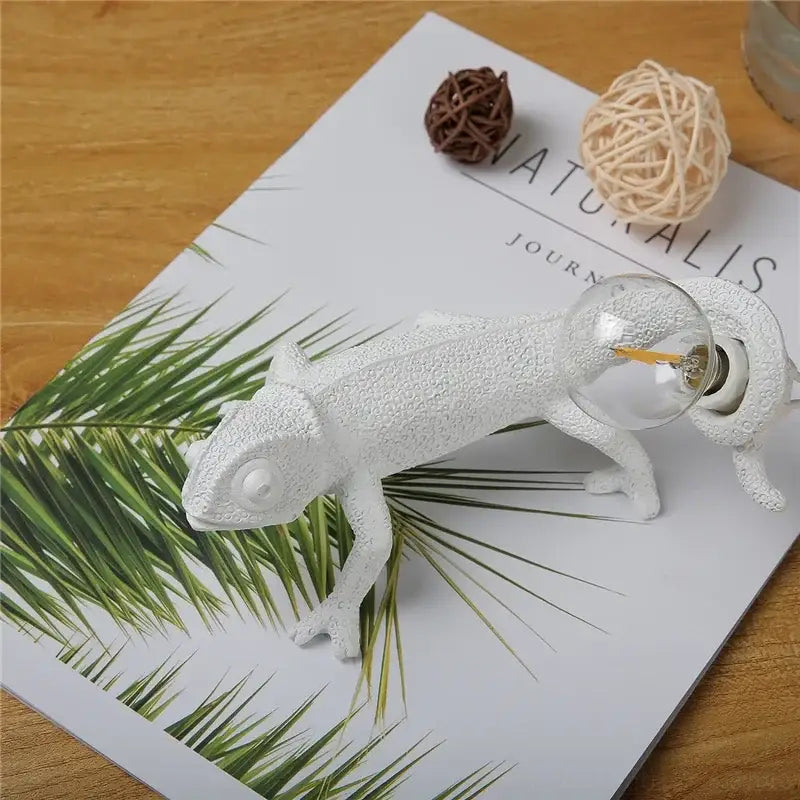 Modern white resin chameleon led table lamp with textured design and clear glass bulb for bedroom reading decorbites chameleon led