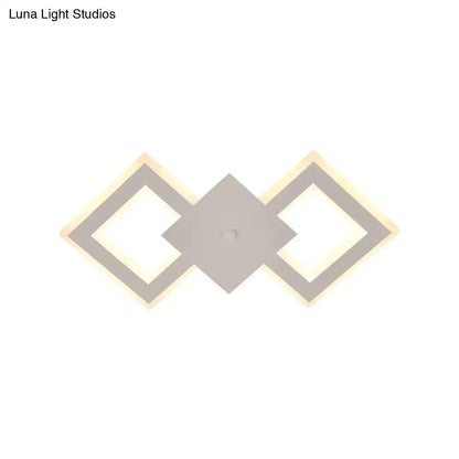 Modern white rhombus led wall sconce with three matte gray geometric panels providing white warm light type