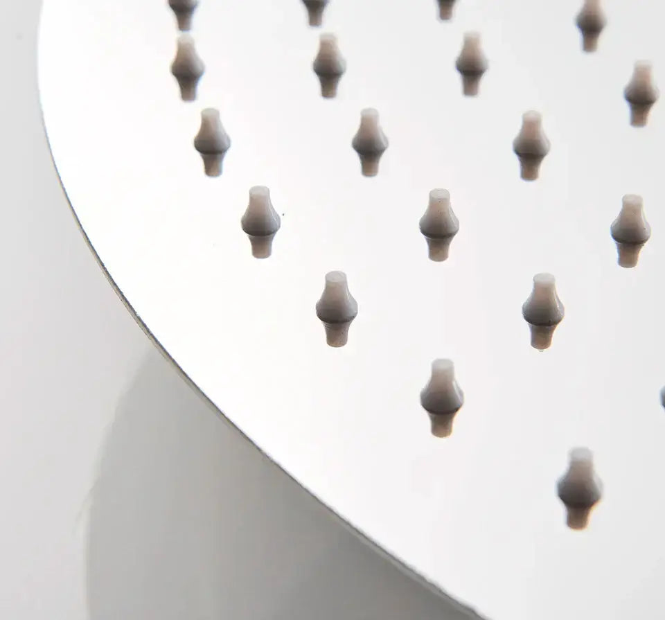 Modern white round rainfall shower head chrome shower head with multiple evenly spaced rounded nozzles bathroom fixture
