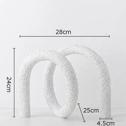Modern white speckled ceramic abstract twisted knot sculpture with textured interlocking curved arches for living room decor
