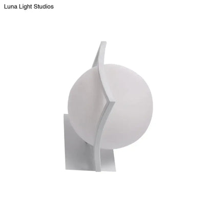 Modern white sphere opal glass wall sconce with sleek angular arms direct wired electric kitchen light