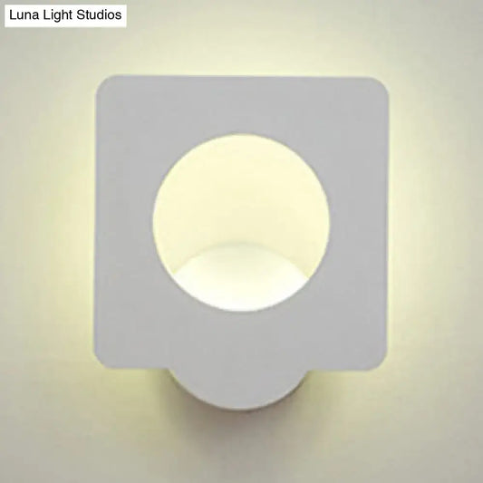 Modern white square led wall sconce with matte finish and circular cutout emitting warm natural light with color temperature
