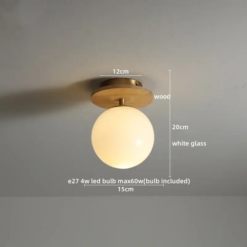 Modern white textured ceramic wood led ceiling light with warm brass-finished wooden base and opaque glass globe for bedroom decorbites ceramic wood