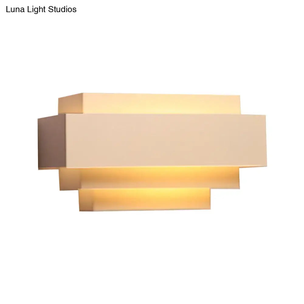 Modern beige wall sconce with layered geometric design and warm ambient lighting for bedroom rectangle wall lamp