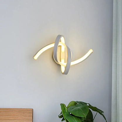 Modern white treble clef led wall sconce with sleek gray and warm white curved arms for bedroom wall lighting