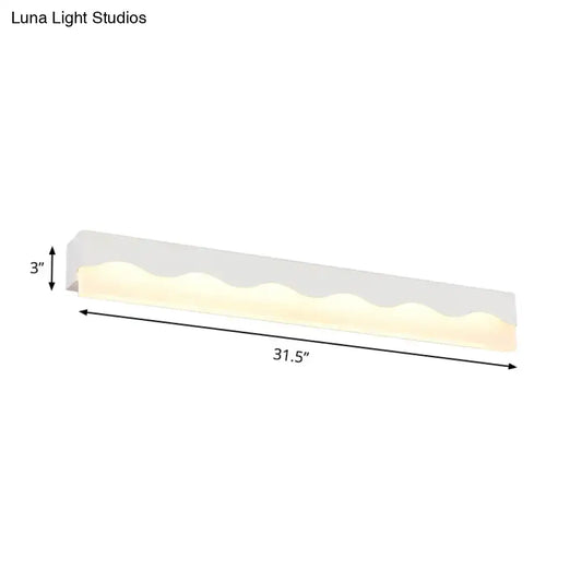 Modern white wave led vanity light fixture with a sleek diffuser and warm glow for bathroom wall lighting