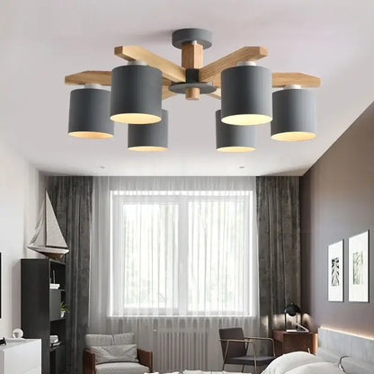 Modern white wood chandelier lighting fixture with five matte gray cylindrical shades on wooden crossbeam by decorbites iron