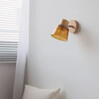 Modern wood and amber glass led wall sconce with decorbites amber glass and wooden base for bedroom decor