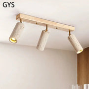 Modern wood and beige concrete led ceiling spotlight with surface mounted led cylinders on brass fittings for living room