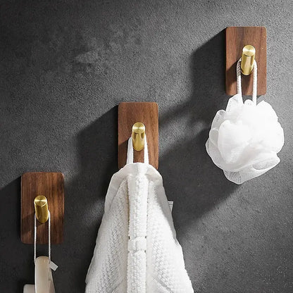 Modern wood and brushed gold wall hook row with brass brushed metal caps for kitchen decorbites use