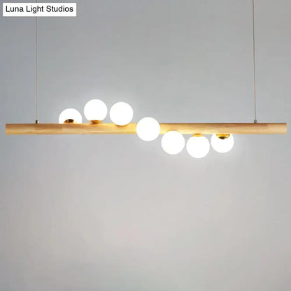 DecorBites minimalistic milk glass suspension light with wooden bar and frosted globes for dining room lighting