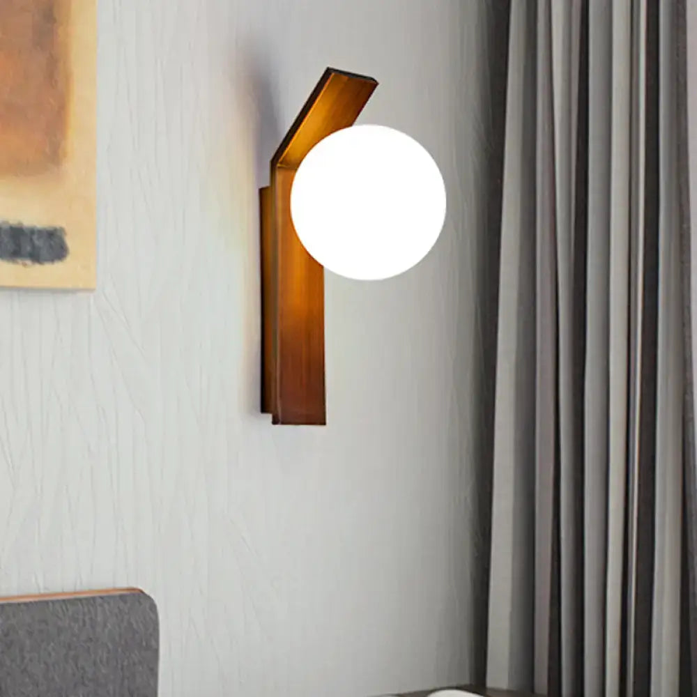 Modern wood wall sconce with warm wooden frame and frosted milk glass shade for dining room lighting