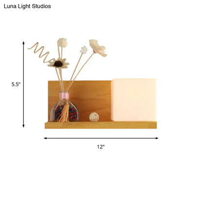 Modern wood floating shelf with beige wall lamp sconce light featuring warm glow and dried flowers for bedroom use