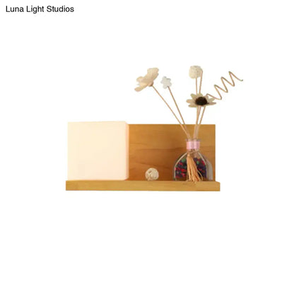 Modern wood floating shelf with beige wall lamp sconce light featuring a wooden shelf base and matching backdrop