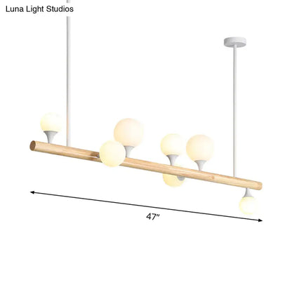 Modern wood island lamp with natural wood rod and five frosted glass globe bulbs for dining room use