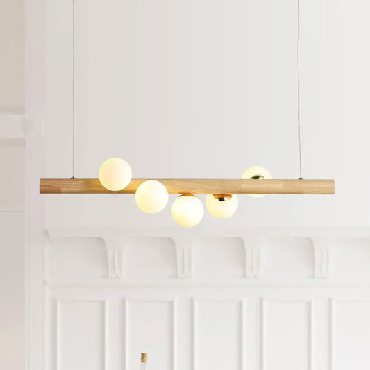 DecorBites modern wood island ceiling light with opal glass spherical shades and adjustable fixture height for dining room
