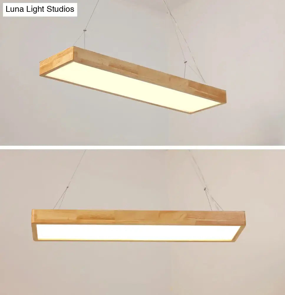 Rectangular wooden ceiling light fixture with a warm white led panel in warm third gear for dining room illumination