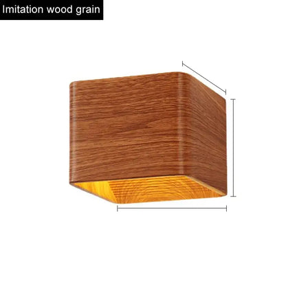 Modern wooden cube led wall light with warm brown wood grain exterior and amber glow ideal for bedroom decorbites led wall