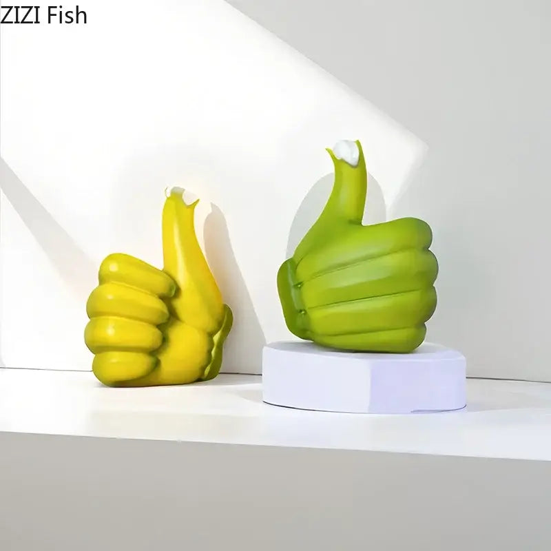 Modern yellow banana fist resin statue desk ornament featuring two glossy yellow and lime green thumbs-up sculptures