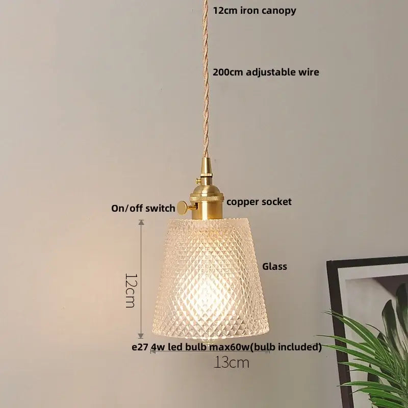 Modern yellow conical pendant light with a textured glass shade, brass-finished iron canopy, and decorbites copper knob for kitchens