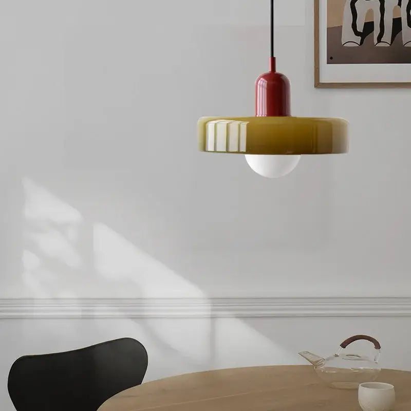 Modern yellow and olive green glass chandelier pendant light with red cylindrical top and ribbed shade for bedroom