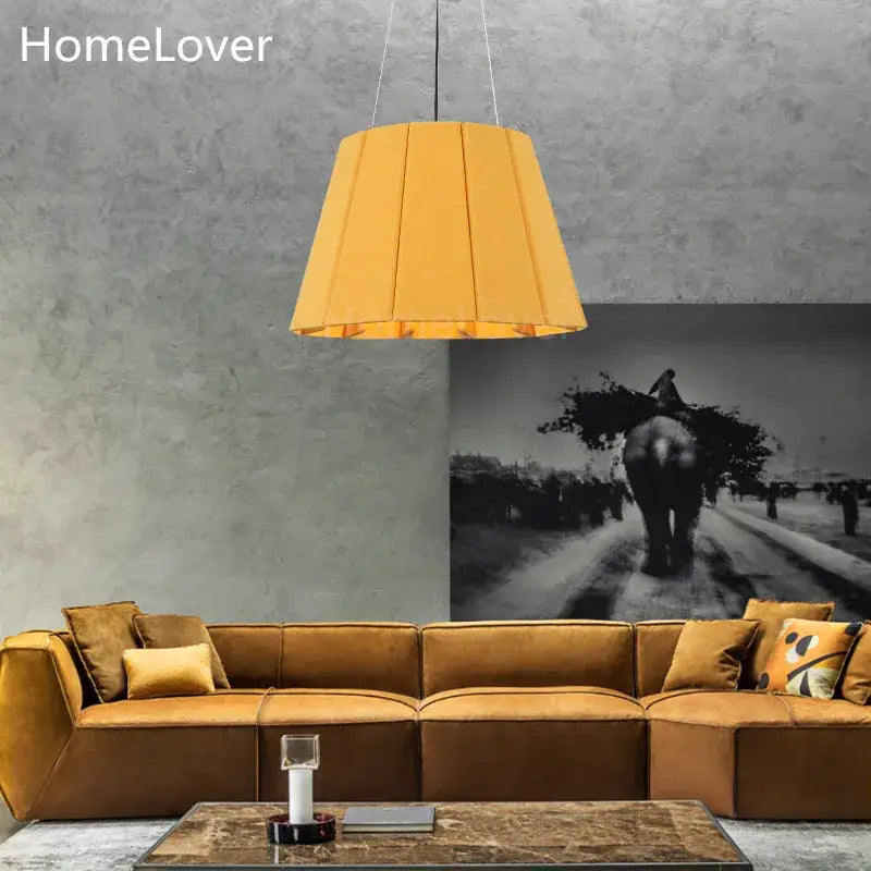 Modern yellow pleated fabric felt pendant light with warm soft glow ideal as a dining room felt pendant light
